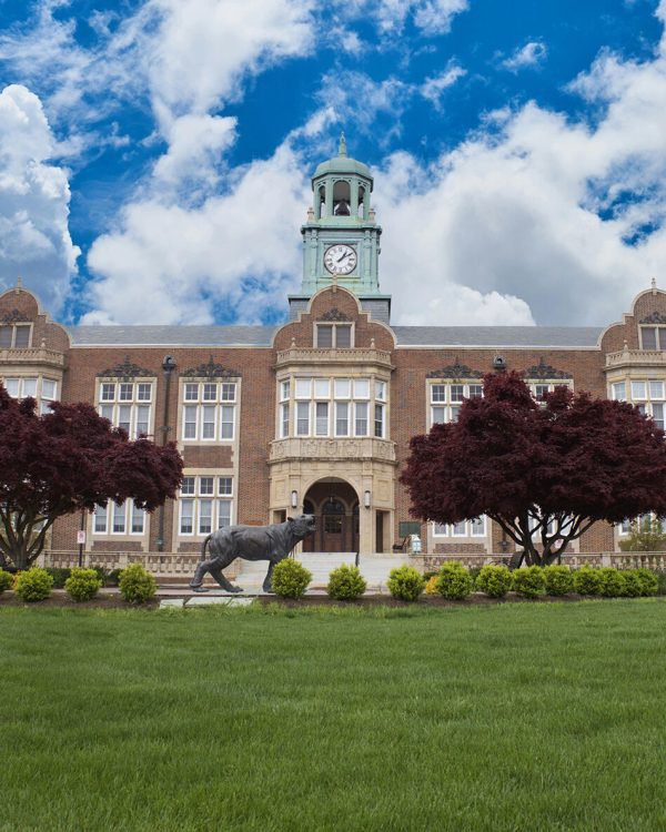 image of a university with blue sky